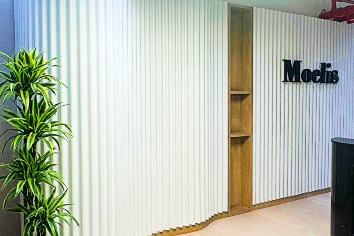 Curved DecraWave acoustic panels in modern commercial hallway